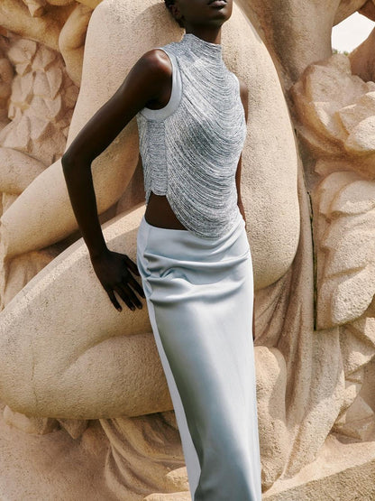Elegant Celadon Ensemble: Sleeveless Fringe Top Paired with Flowing Satin Skirt
