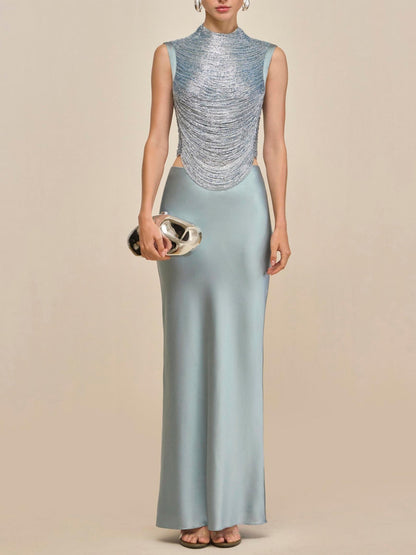 Elegant Celadon Ensemble: Sleeveless Fringe Top Paired with Flowing Satin Skirt