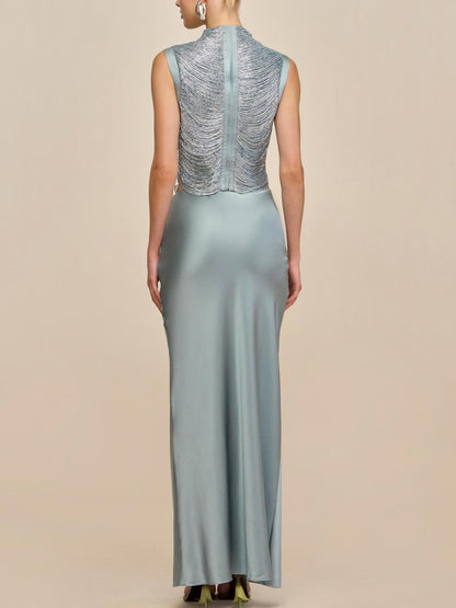 Elegant Celadon Ensemble: Sleeveless Fringe Top Paired with Flowing Satin Skirt