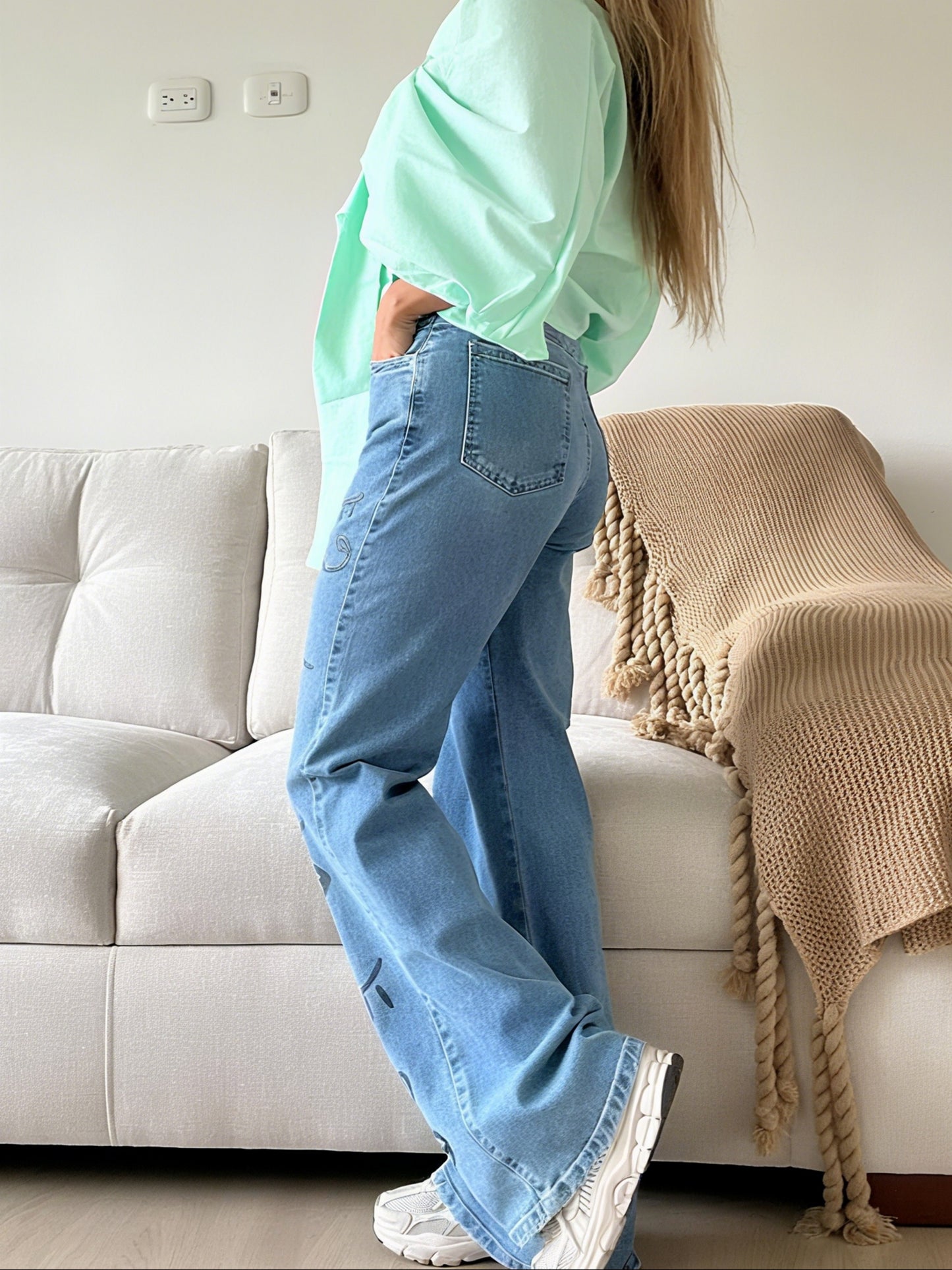Stylish Blue Jeans Featuring Artistic Black - Ink Drawings